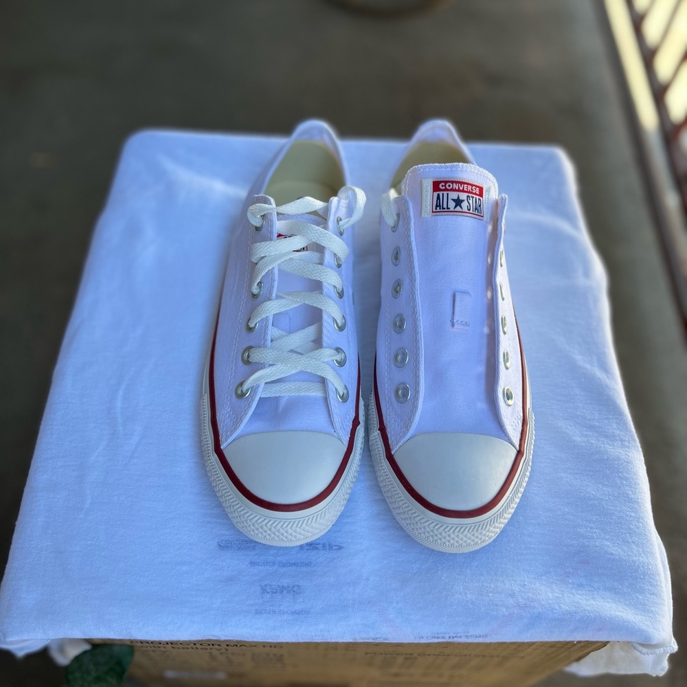 Man and woman, converse sneaker shoes. Men’s size 7, women’s size